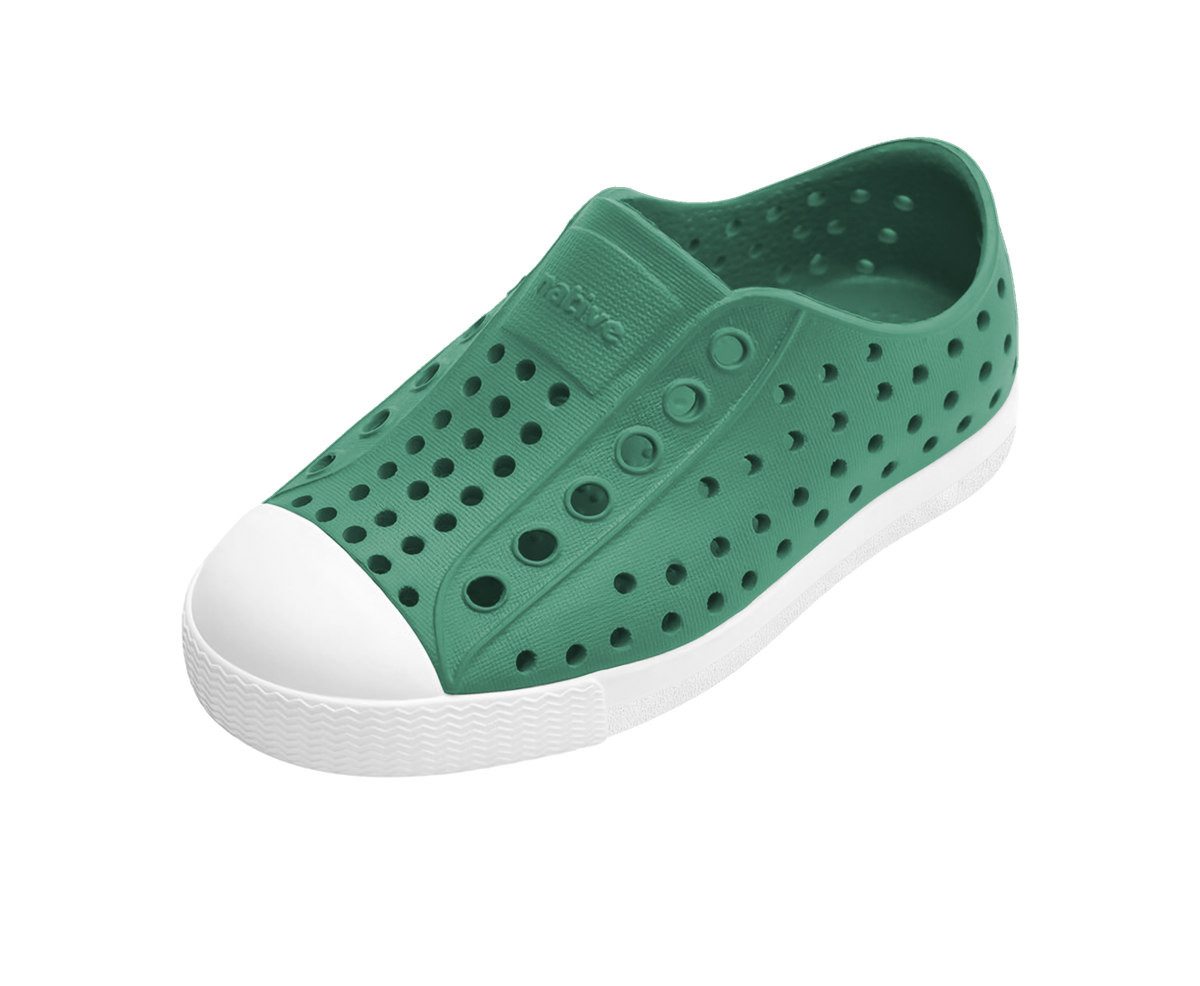 Angled view of a Native Shoes Kids Jefferson Kids | Alpine Green / Shell White Footwear in Alpine Green / Shell White