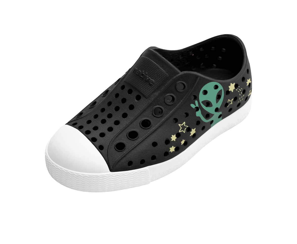 Angled view of a Native Shoes Kids Jefferson Block Kids | Jiffy Black / Shell White / Peace Alien Block Footwear in Jiffy Black / Shell White / Peace Alien Block