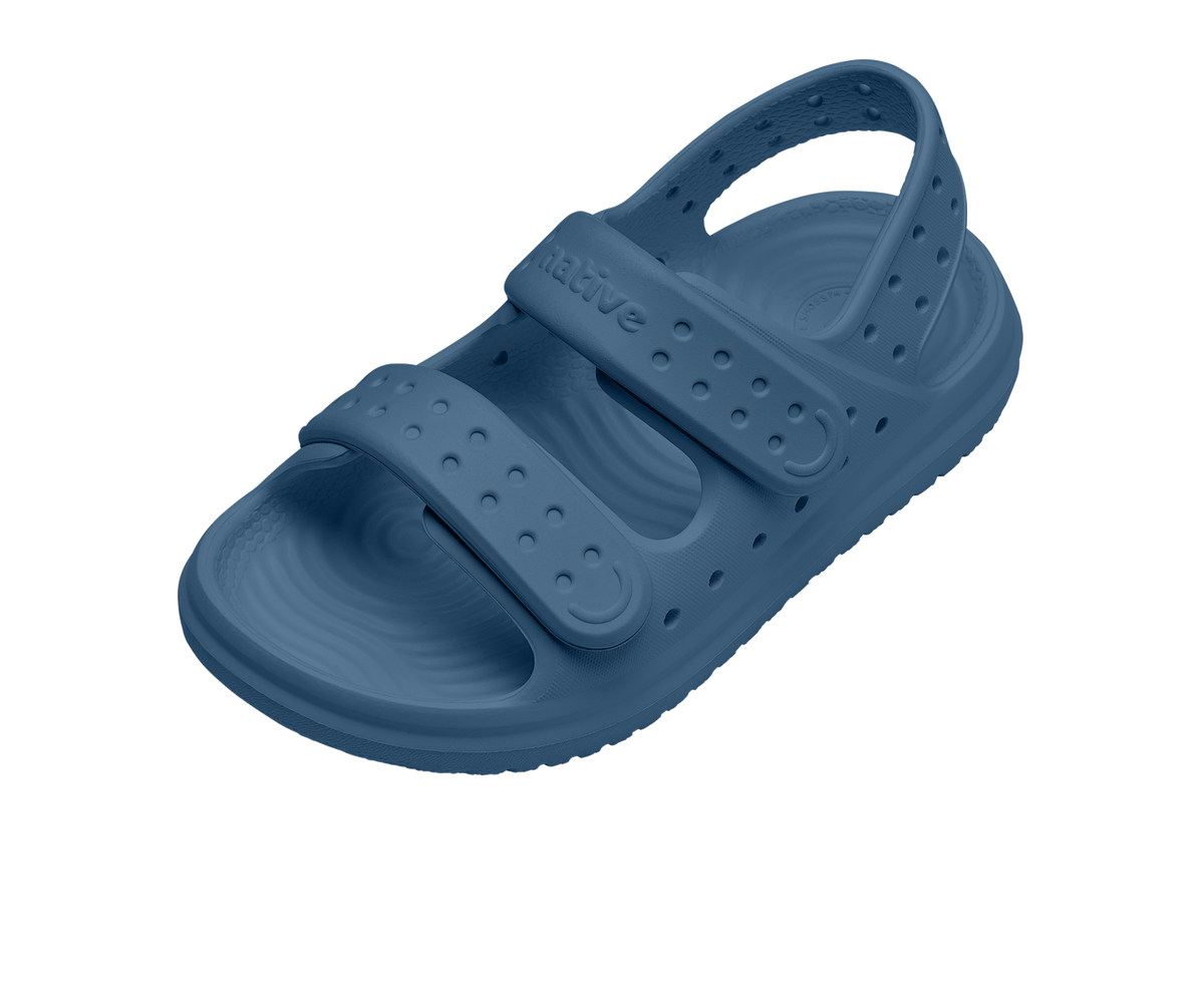 Angled view of a Native Shoes Kids Chase Kids | Oasis Blue / Oasis Blue Footwear in Oasis Blue / Oasis Blue