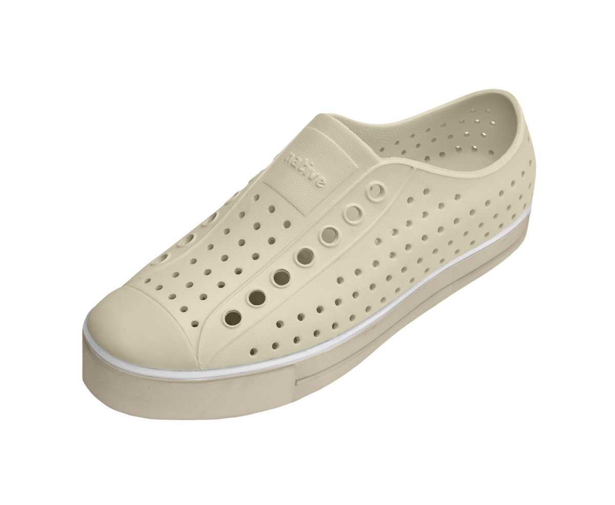 Angled view of a Native Shoes Jefferson Arc Wanderfoam | Bone White / Fog Beige Footwear in Bone White / Fog Beige