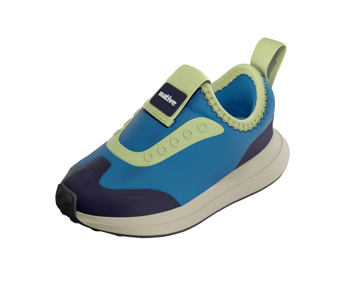 Angled view of a Native Shoes Kids Robbie Dash Kids | Megamarine Blue / Tapioca Off White / Jiffy Black Footwear in Megamarine Blue / Tapioca Off White / Jiffy Black
