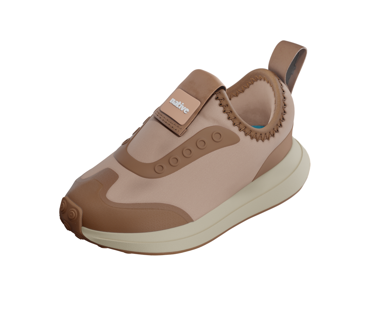 Angled view of a Native Shoes Kids Robbie Dash Kids | Chameleon Pink / Tapioca Off White / Hazel Brown Footwear in Chameleon Pink / Tapioca Off White / Hazel Brown