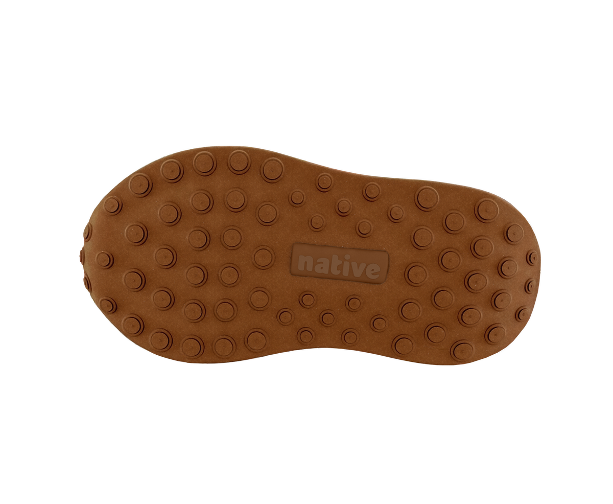 Bottom view of a Native Shoes Kids Robbie Dash Kids | Chameleon Pink / Tapioca Off White / Hazel Brown Footwear in Chameleon Pink / Tapioca Off White / Hazel Brown