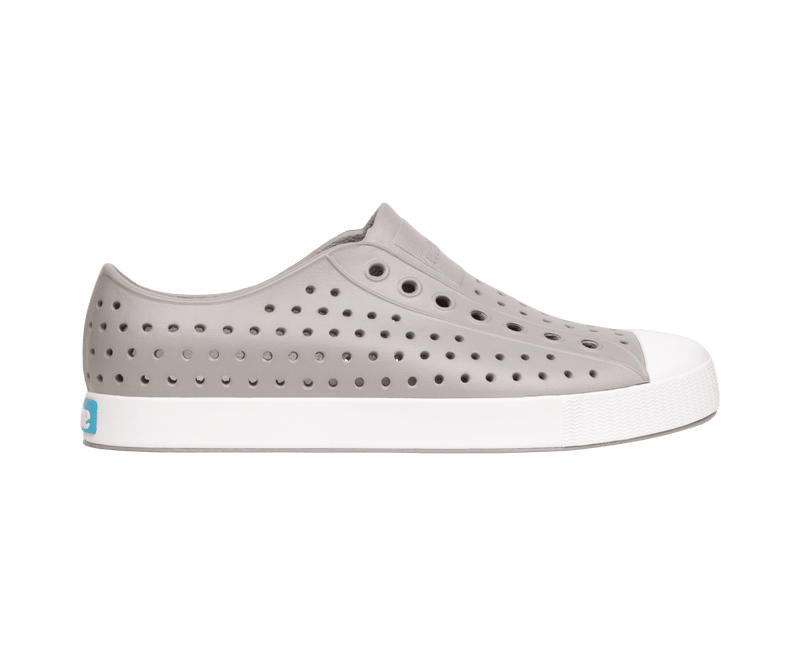 Side view of a Native Shoes Adults Jefferson Footwear in Pigeon Grey / Shell White