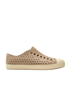 Side view of a Native Shoes Adults Jefferson Footwear in Flax Tan / Bone White