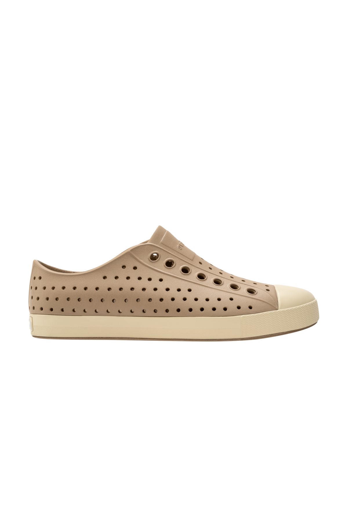 Side view of a Native Shoes Adults Jefferson Footwear in Flax Tan / Bone White