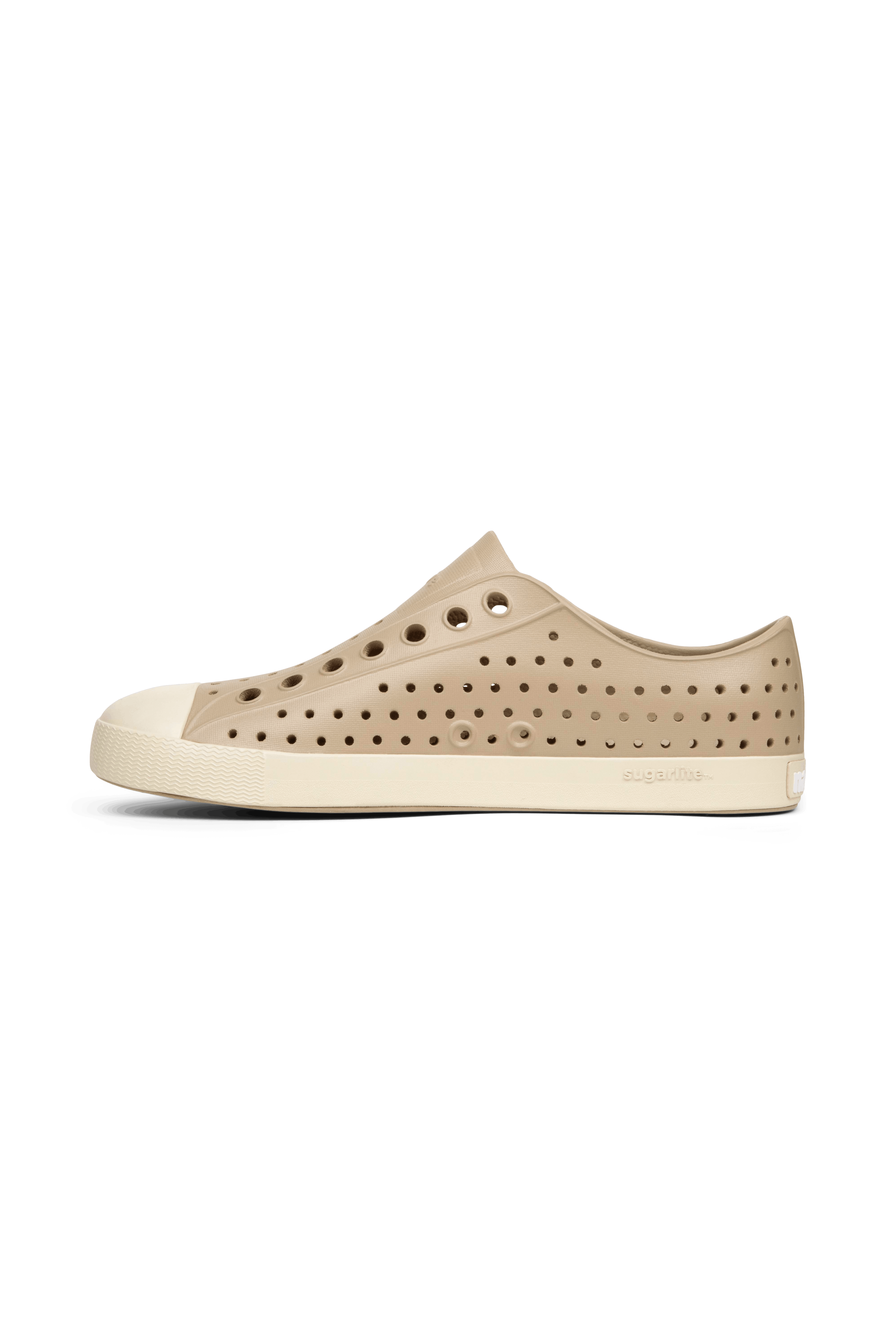 Angled view of a Native Shoes Jefferson | Flax Tan / Bone White Footwear in Flax Tan / Bone White