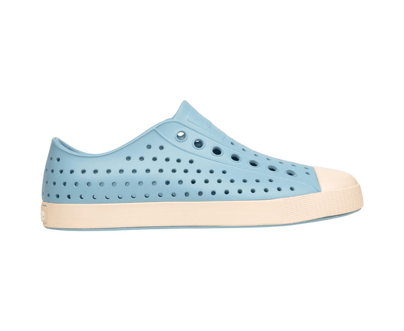 Side view of a Native Shoes Adults Jefferson Footwear in Flux Blue / Bone White