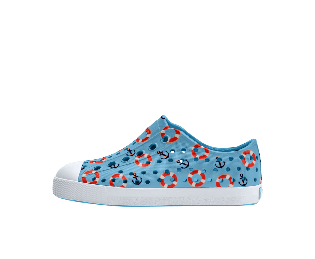 Side view of a Native Shoes Kids Jefferson Print Kids Footwear in Aquarius Blue / Shell White / Anchors