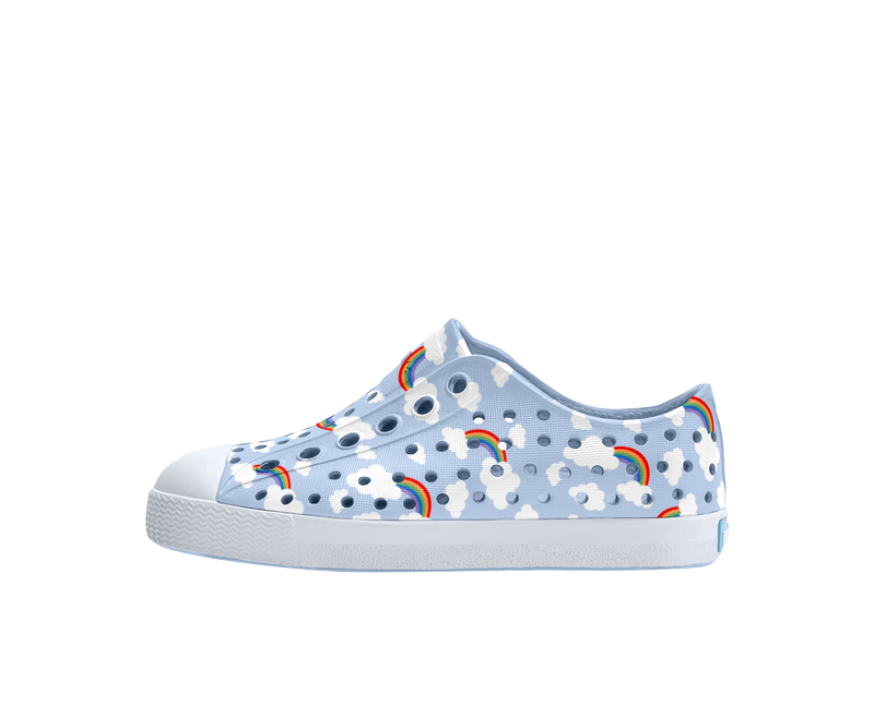 Side view of a Native Shoes Kids Jefferson Print Kids Footwear in Skyway Blue / Shell White / Cloud Rainbow