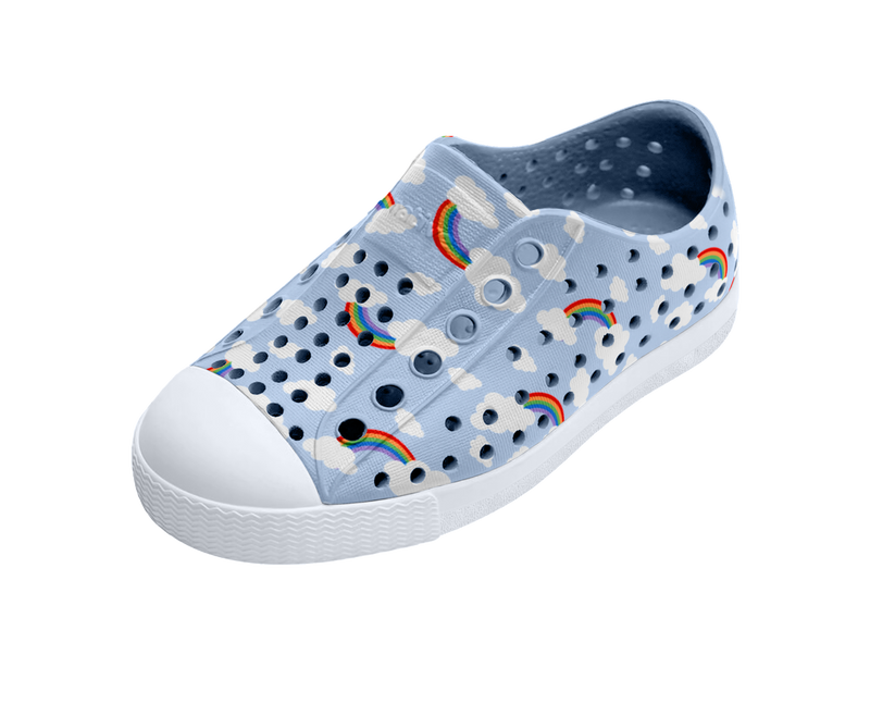 Angled view of a Native Shoes Kids Jefferson Print Kids | Skyway Blue / Shell White / Cloud Rainbow Footwear in Skyway Blue / Shell White / Cloud Rainbow