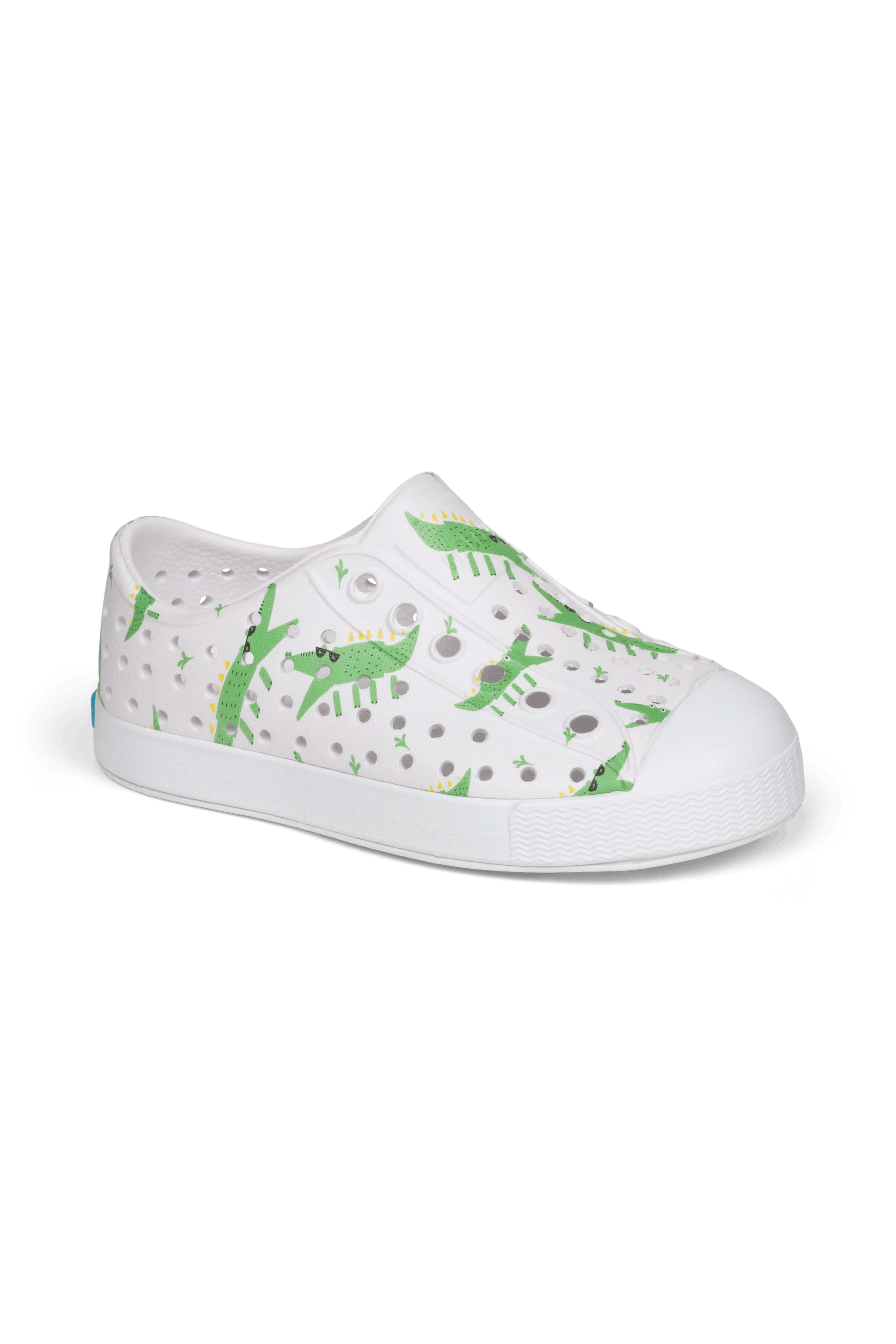 Angled view of a Native Shoes Kids Jefferson Print Kids | Shell White / Shell White / Alligators Footwear in Shell White / Shell White / Alligators