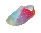 Angled view of a Native Shoes Kids Jefferson Print Kids | Shell White / Transparent / Rainbow Spray Footwear in Shell White / Transparent / Rainbow Spray
