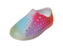 Angled view of a Native Shoes Kids Jefferson Print Kids | Shell White / Transparent / Rainbow Spray Footwear in Shell White / Transparent / Rainbow Spray