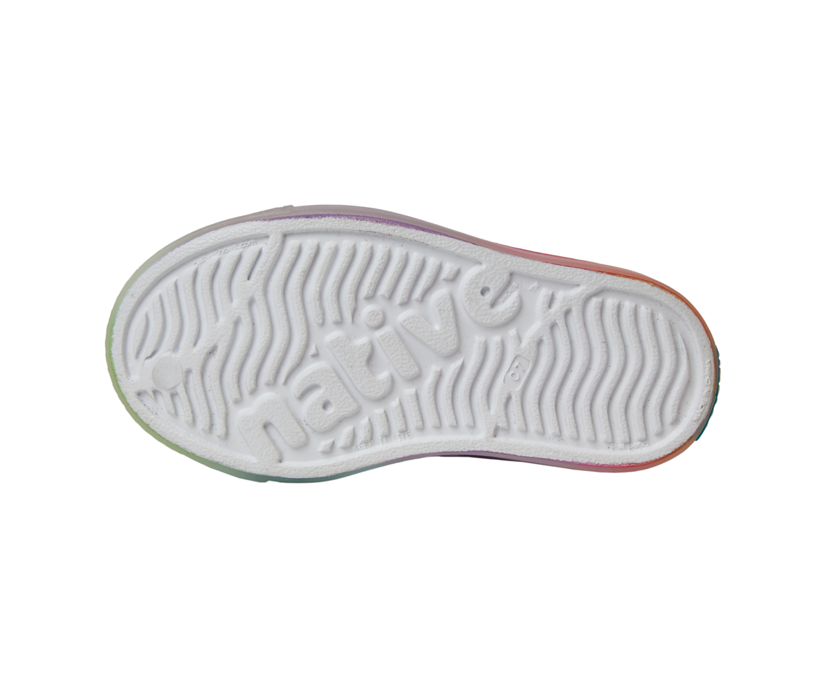 Bottom view of a Native Shoes Kids Jefferson Print Kids | Shell White / Transparent / Rainbow Spray Footwear in Shell White / Transparent / Rainbow Spray