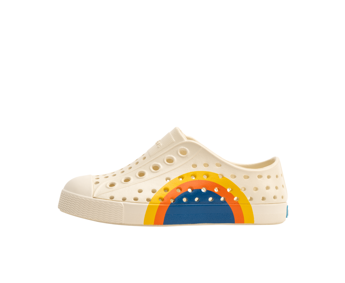 Side view of a Native Shoes Kids Jefferson Block Kids Footwear in Bone White / Bone White / Spicy Laflame Vallarta Circle