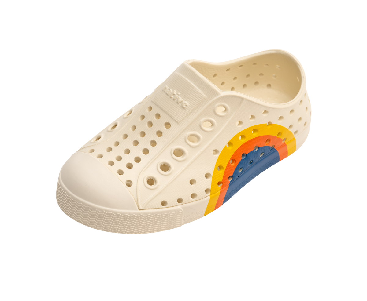 Angled view of a Native Shoes Kids Jefferson Block Kids | Bone White / Bone White / Spicy Laflame Vallarta Circle Footwear in Bone White / Bone White / Spicy Laflame Vallarta Circle