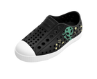 Angled view of a Native Shoes Kids Jefferson Block Kids | Jiffy Black / Shell White / Peace Alien Block Footwear in Jiffy Black / Shell White / Peace Alien Block