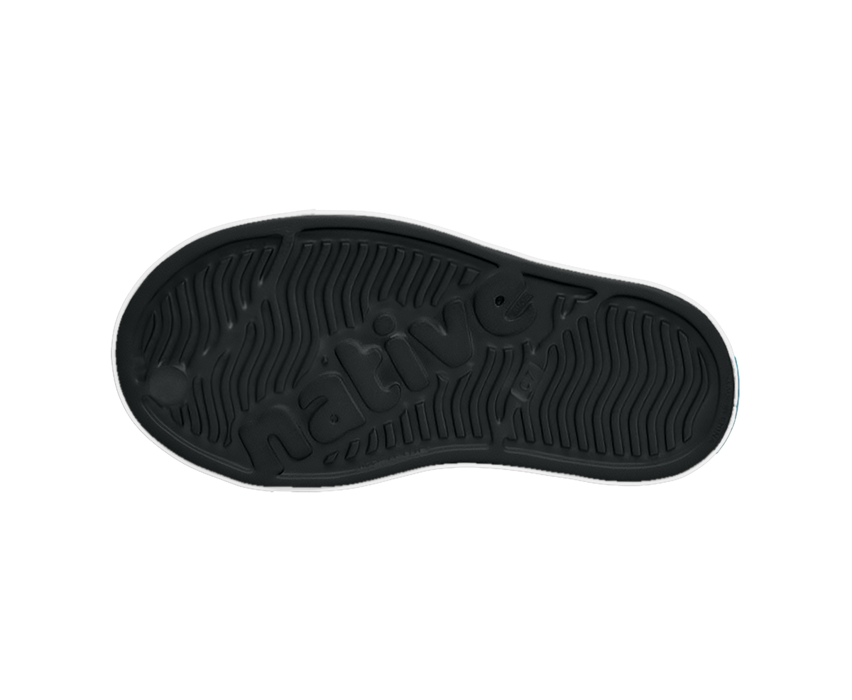 Bottom view of a Native Shoes Kids Jefferson Block Kids | Jiffy Black / Shell White / Peace Alien Block Footwear in Jiffy Black / Shell White / Peace Alien Block