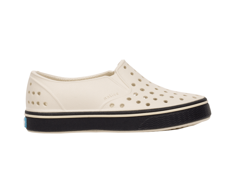 Side view of a Native Shoes Kids Miles Kids Footwear in Bnwht/Jfyblk