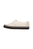 Angled view of a Native Shoes Kids Miles Kids | Bnwht/Jfyblk Footwear in Bnwht/Jfyblk