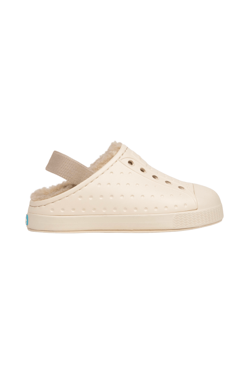 Side view of a Native Shoes Kids Jefferson Cozy Kids Footwear in Bone White / Bone White / Flax Tan