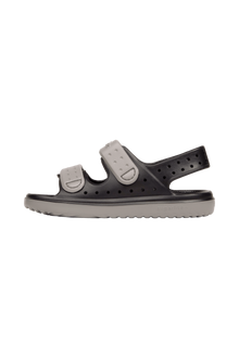 Angled view of a Native Shoes Kids Chase Kids | Jiffy Black / Satellite Grey Footwear in Jiffy Black / Satellite Grey