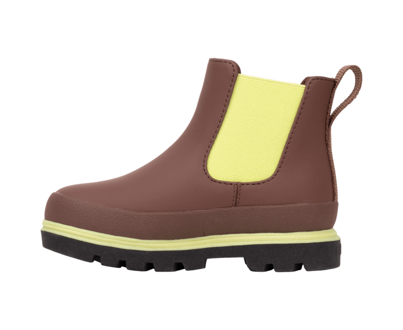 Angled view of a Native Shoes Kids Kensington Chelsea Kids | Bitbr/Jfyblk/Kingr Footwear in Bitbr/Jfyblk/Kingr