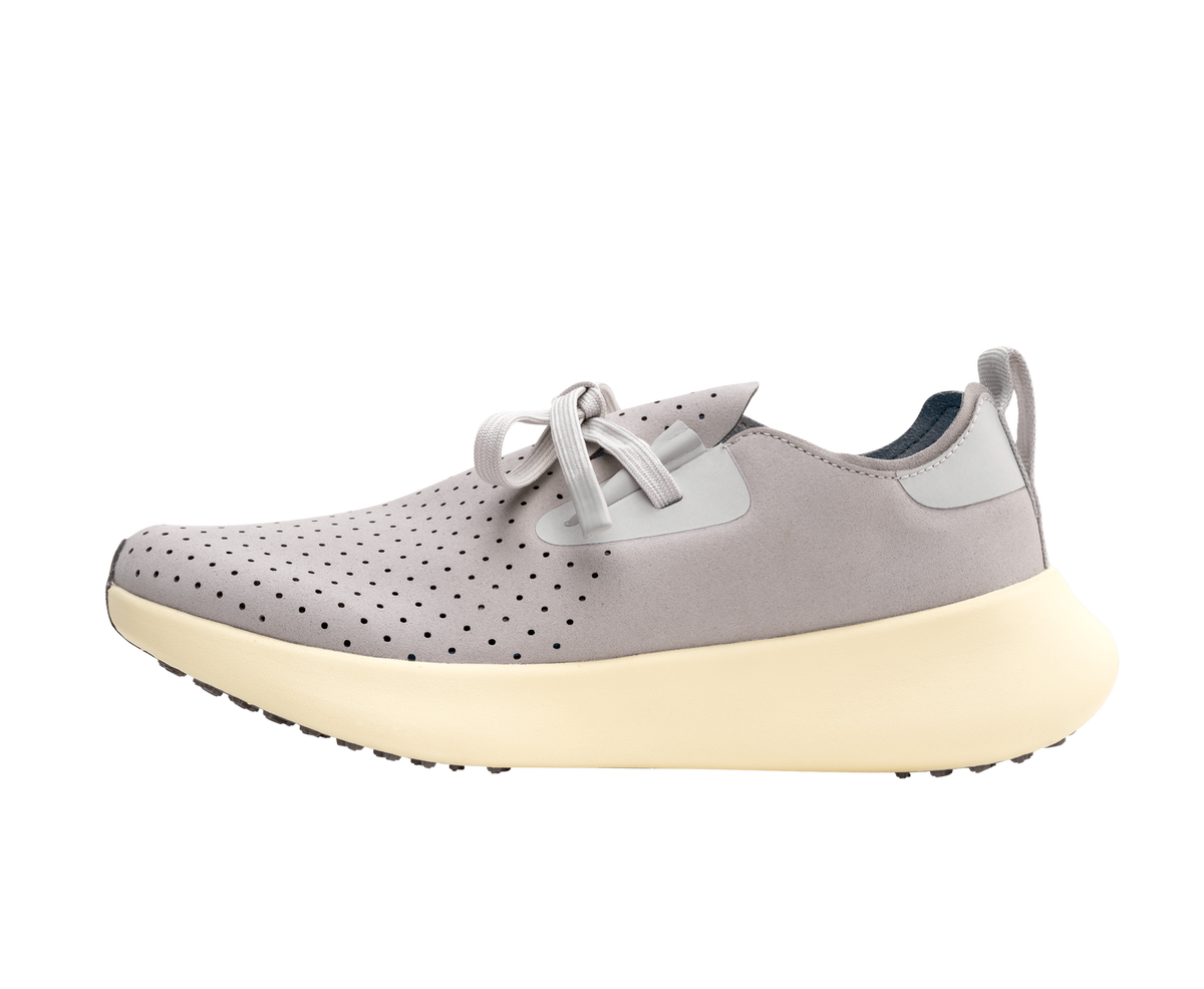 Side view of a Native Shoes Adults Apollo 10 Footwear in Ghost Grey / Tapioca Off White