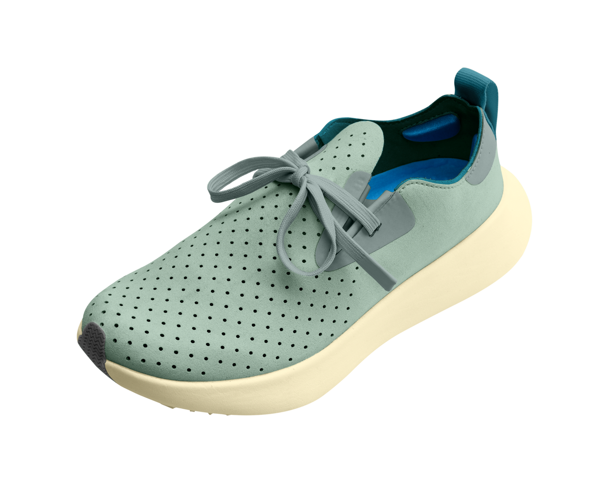 Angled view of a Native Shoes Apollo 10 | Relax Green / Tapioca Off White Footwear in Relax Green / Tapioca Off White