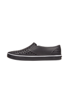 Angled view of a Native Shoes Miles Wanderfoam | Jiffy Black / Jiffy Black Footwear in Jiffy Black / Jiffy Black