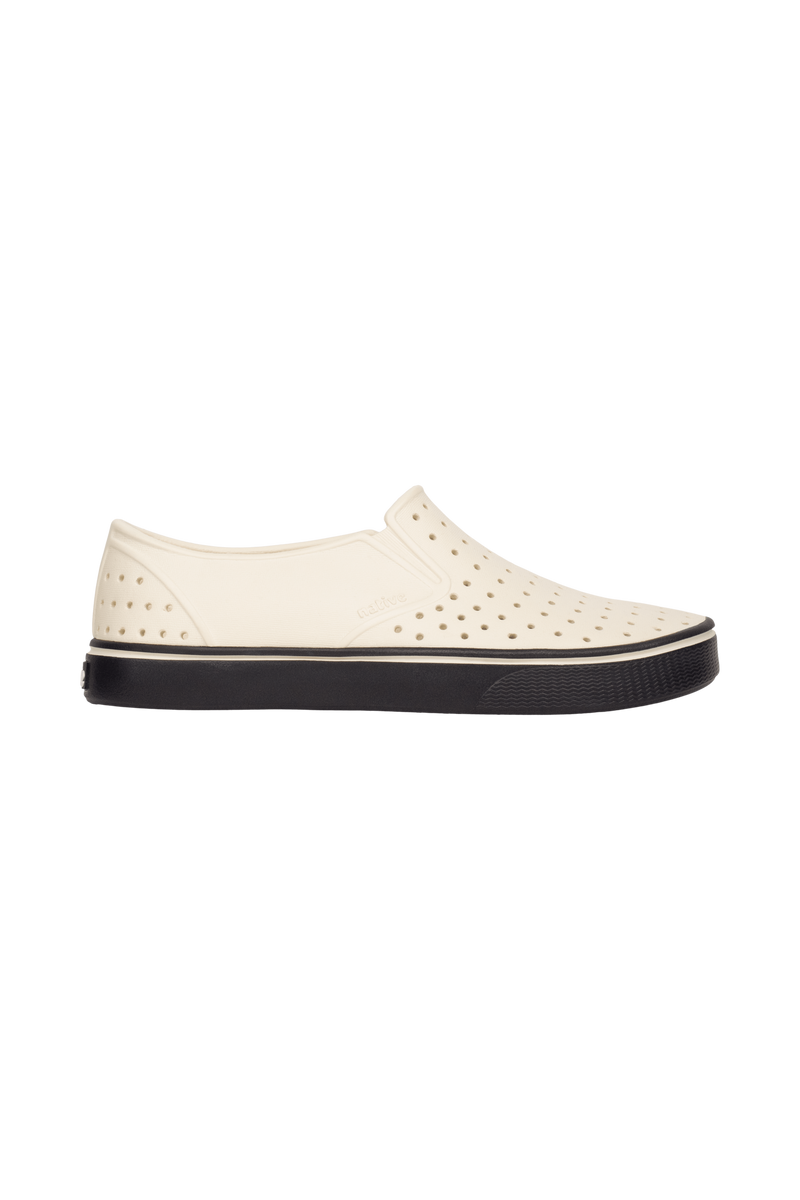 Side view of a Native Shoes Adults Miles Wanderfoam Footwear in Bnwht/Jfyblk