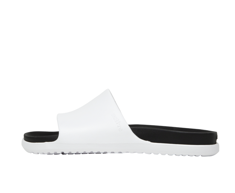Side view of a Native Shoes Adults Spencer Lx Wanderfoam Footwear in Shell White / Jiffy Black