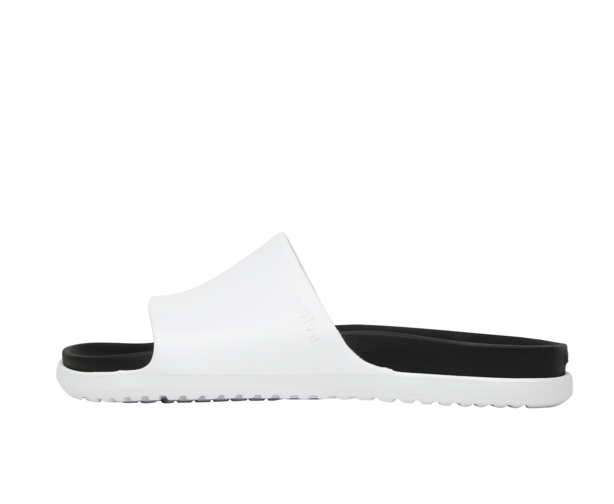 Side view of a Native Shoes Adults Spencer Lx Wanderfoam Footwear in Shell White / Jiffy Black