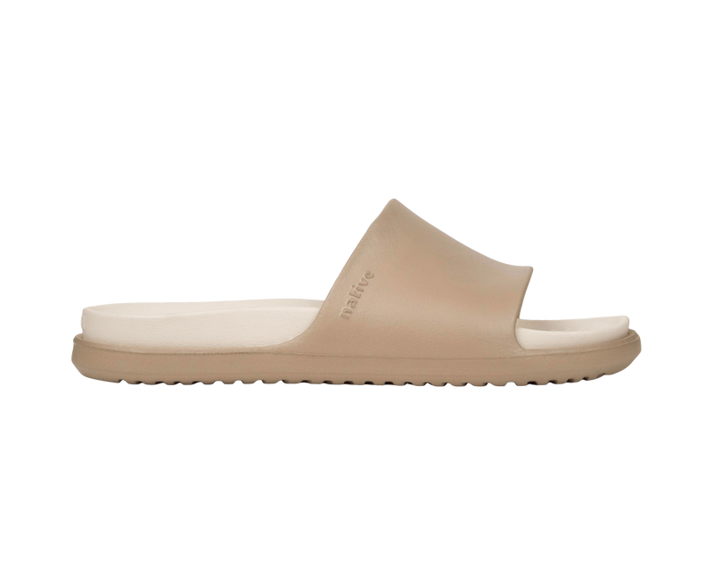 Side view of a Native Shoes Adults Spencer Lx Wanderfoam Footwear in Flax Tan / Bone White