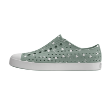 Side view of a Native Shoes Adults Jefferson Wanderfoam Print Footwear in Relax Green / Shell White / Freesia Star Badge