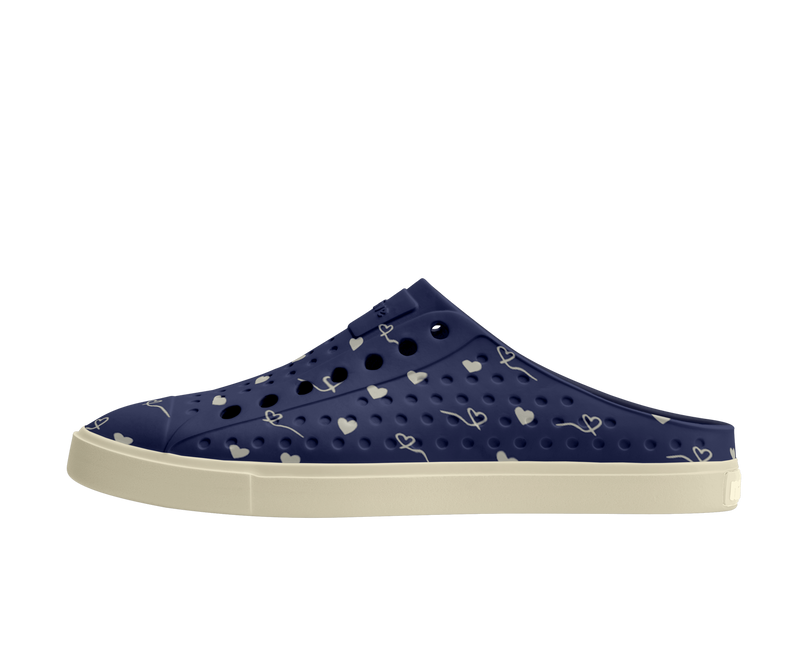 Side view of a Native Shoes Adults Jefferson Clog Wanderfoam Prnt Footwear in Bone White / Bone White / Regatta Hearts