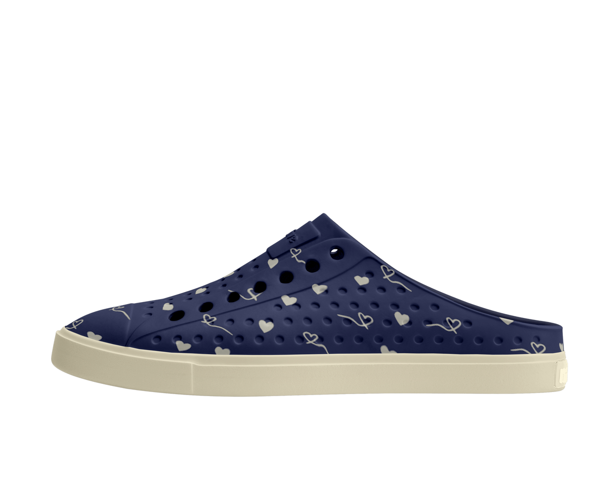 Side view of a Native Shoes Adults Jefferson Clog Wanderfoam Prnt Footwear in Bone White / Bone White / Regatta Hearts