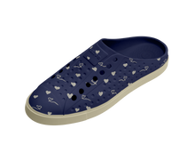 Angled view of a Native Shoes Jefferson Clog Wanderfoam Prnt | Bone White / Bone White / Regatta Hearts Footwear in Bone White / Bone White / Regatta Hearts