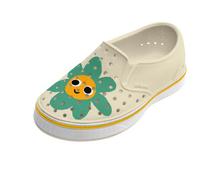 Angled view of a Native Shoes Kids Miles Block Kids | Bone White / Shell White / Happy Flower Block Footwear in Bone White / Shell White / Happy Flower Block
