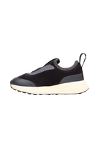 Angled view of a Native Shoes Kids Robbie Dash Kids | Jiffy Black / Tapioca Off White / Jiffy Black Footwear in Jiffy Black / Tapioca Off White / Jiffy Black