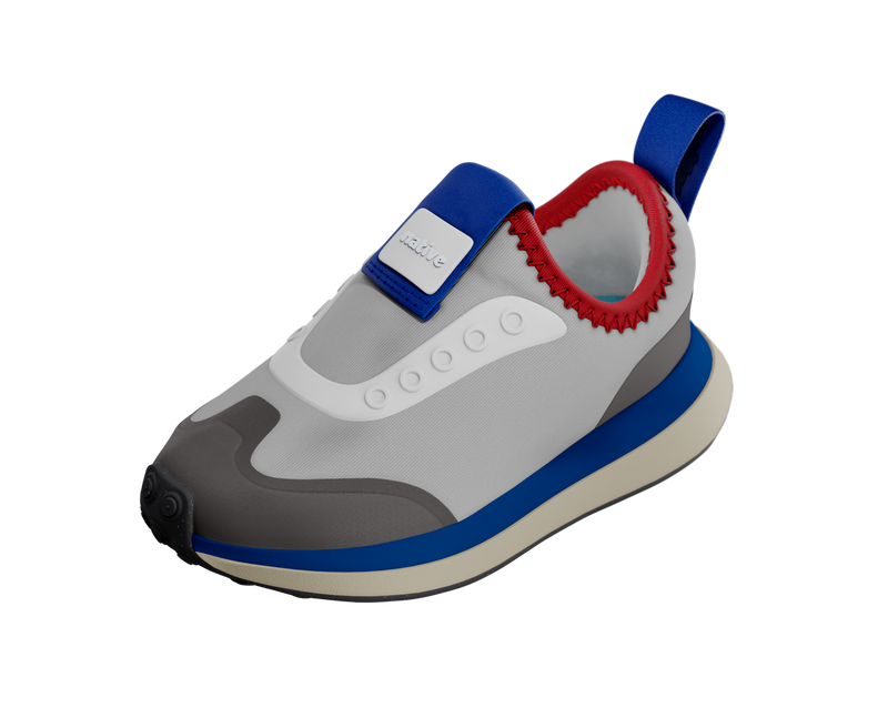 Angled view of a Native Shoes Kids Robbie Dash Kids | Hyams Grey / Tapioca Uv / Jiffy Black Footwear in Hyams Grey / Tapioca Uv / Jiffy Black
