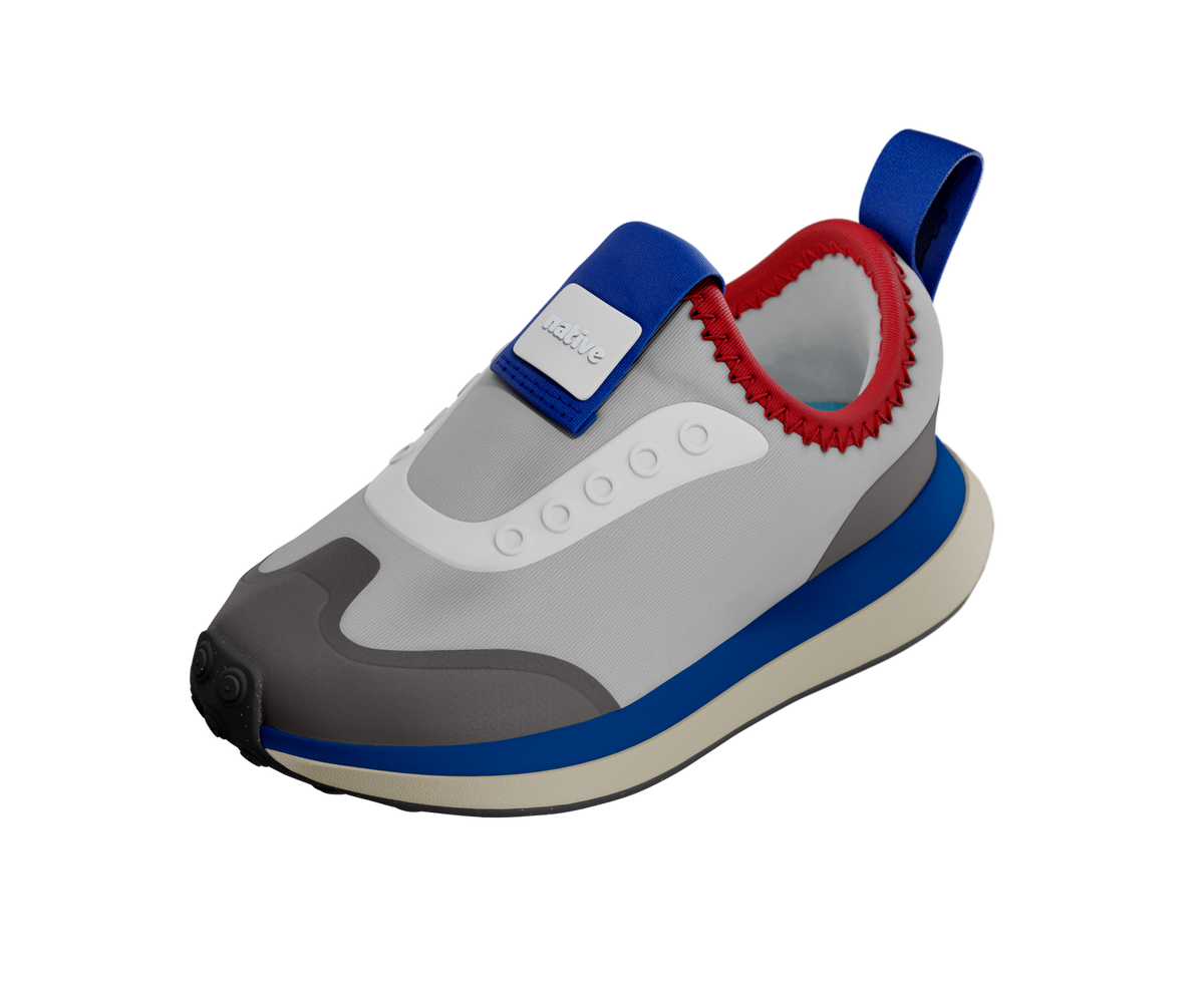 Angled view of a Native Shoes Kids Robbie Dash Kids | Hyams Grey / Tapioca Uv / Jiffy Black Footwear in Hyams Grey / Tapioca Uv / Jiffy Black