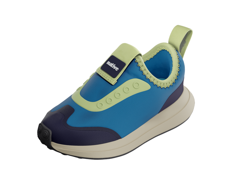 Angled view of a Native Shoes Kids Robbie Dash Kids | Megamarine Blue / Tapioca Off White / Jiffy Black Footwear in Megamarine Blue / Tapioca Off White / Jiffy Black