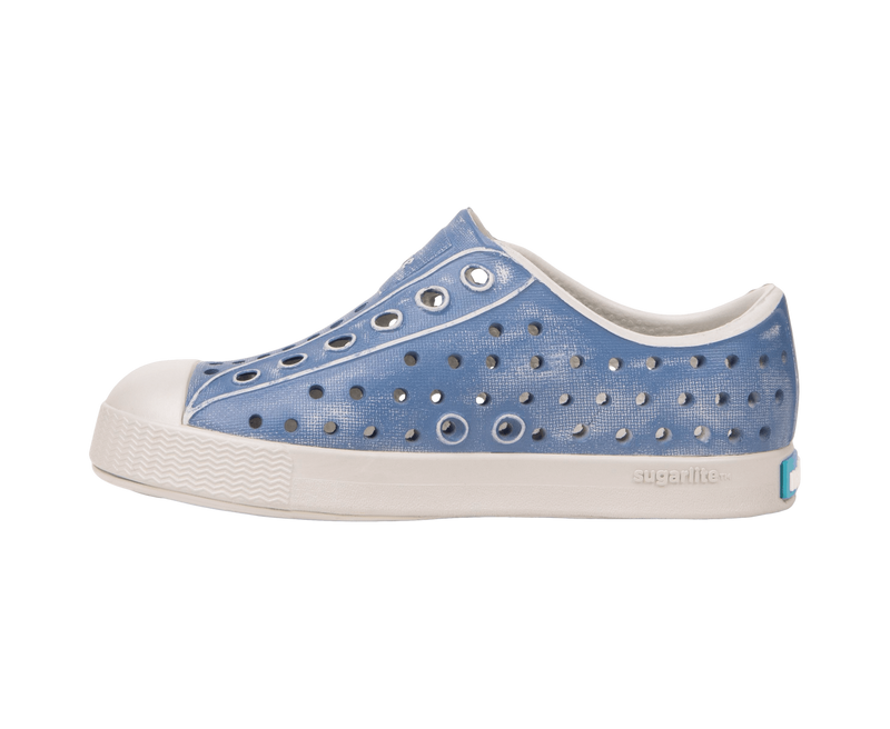 Angled view of a Native Shoes Kids Jefferson Stonewash Kids | Dawn Blue / Dawn Blue / Oasis Brushed Footwear in Dawn Blue / Dawn Blue / Oasis Brushed