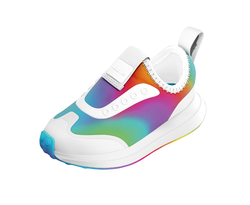 Angled view of a Native Shoes Kids Robbie Dash Print Kids | Shell White / Shell White / Rainbow Footwear in Shell White / Shell White / Rainbow