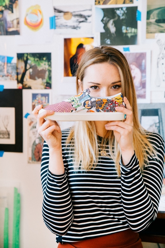 Ola Volo holding her Native Shoes print collaboration shoe.