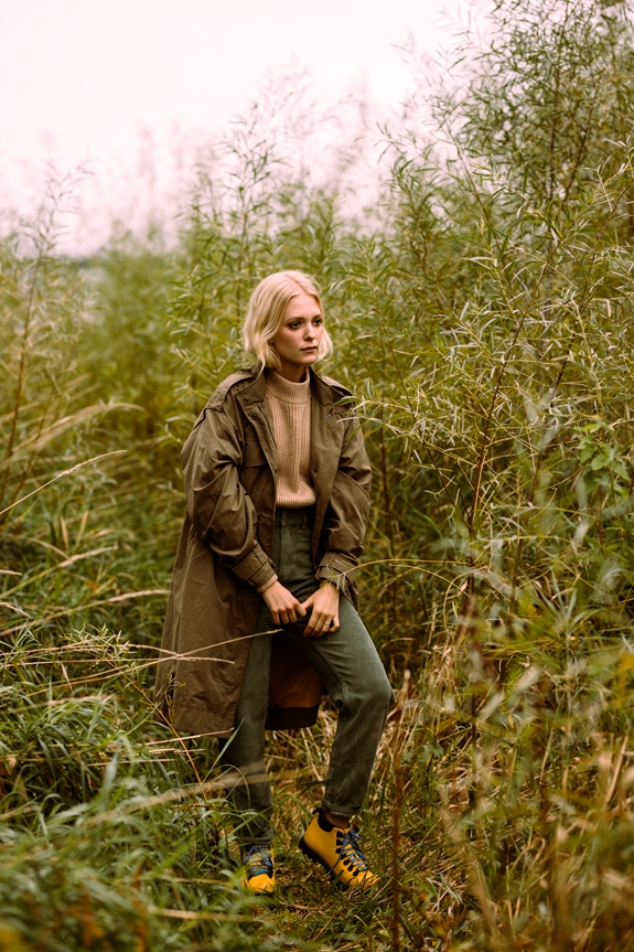 Woman wearing the Native Shoes Fitzsimmons Treklite hiking boots and winter outfit in a marsh 