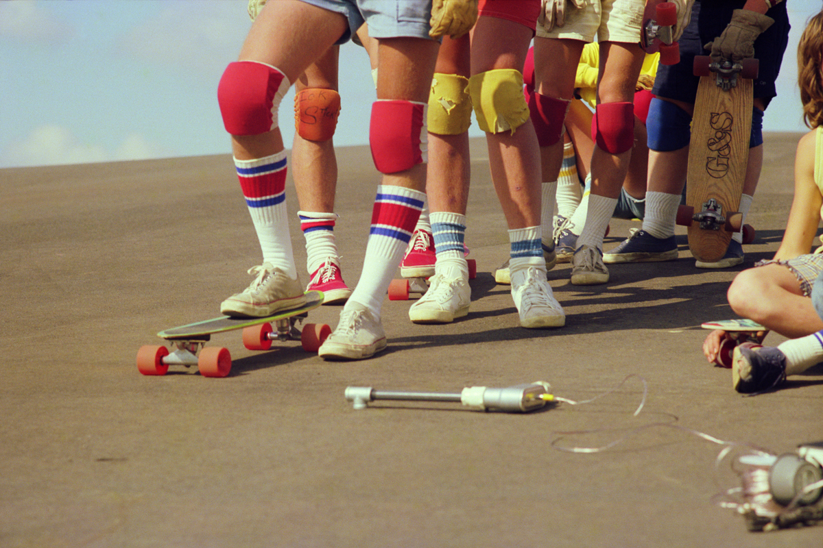 1970’s Hugh Holland image of skateboarders wearing tube socks and knee pads...