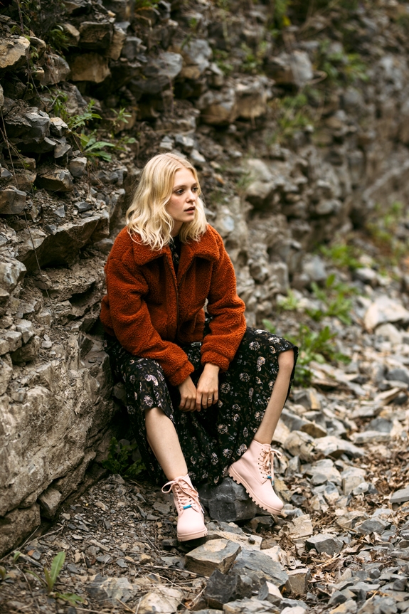 Woman wearing the Johnny Treklite waterproof boots with a winter outfit in the woods